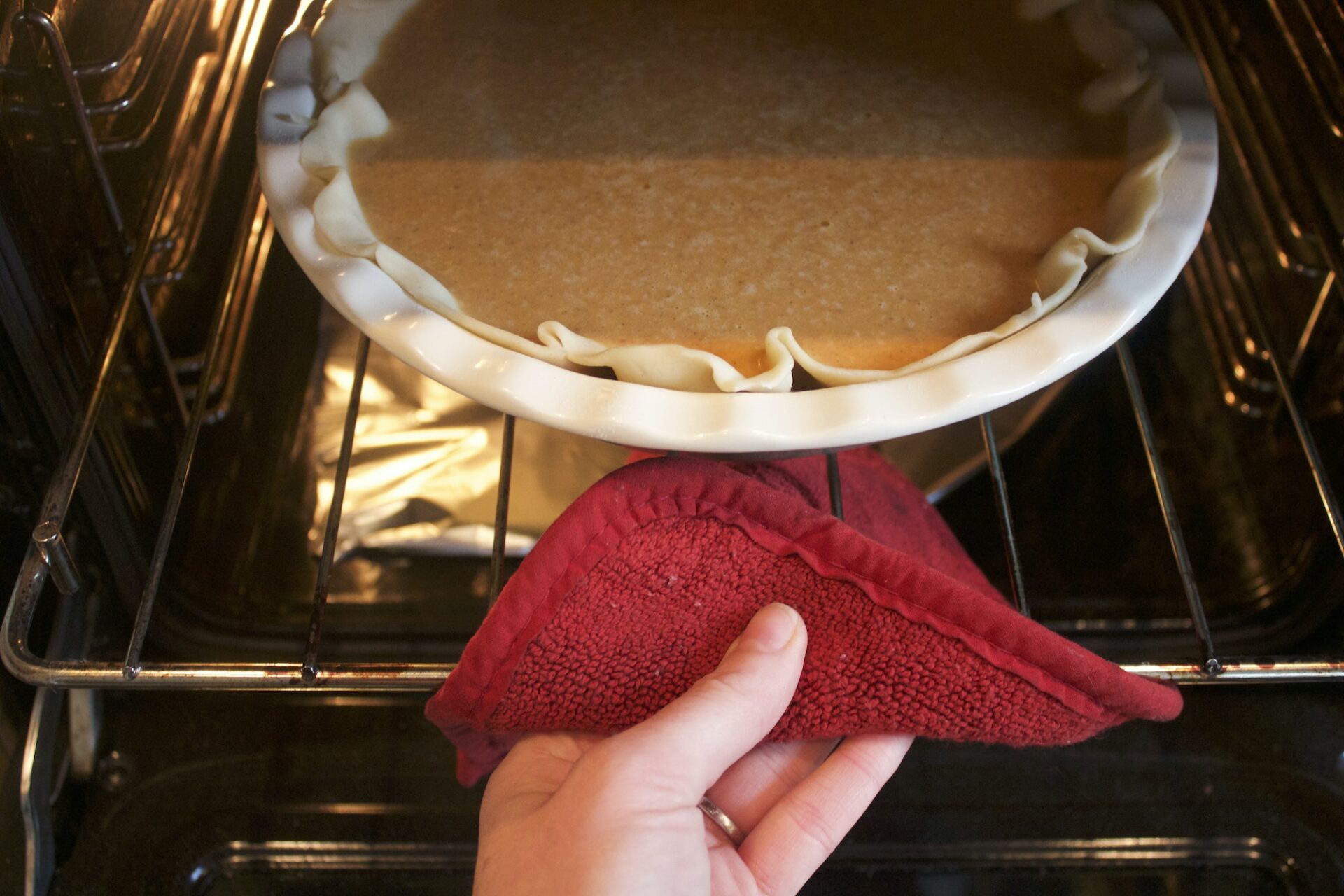 A pie being placed in the oven at Le Gourmet Factory kitchen